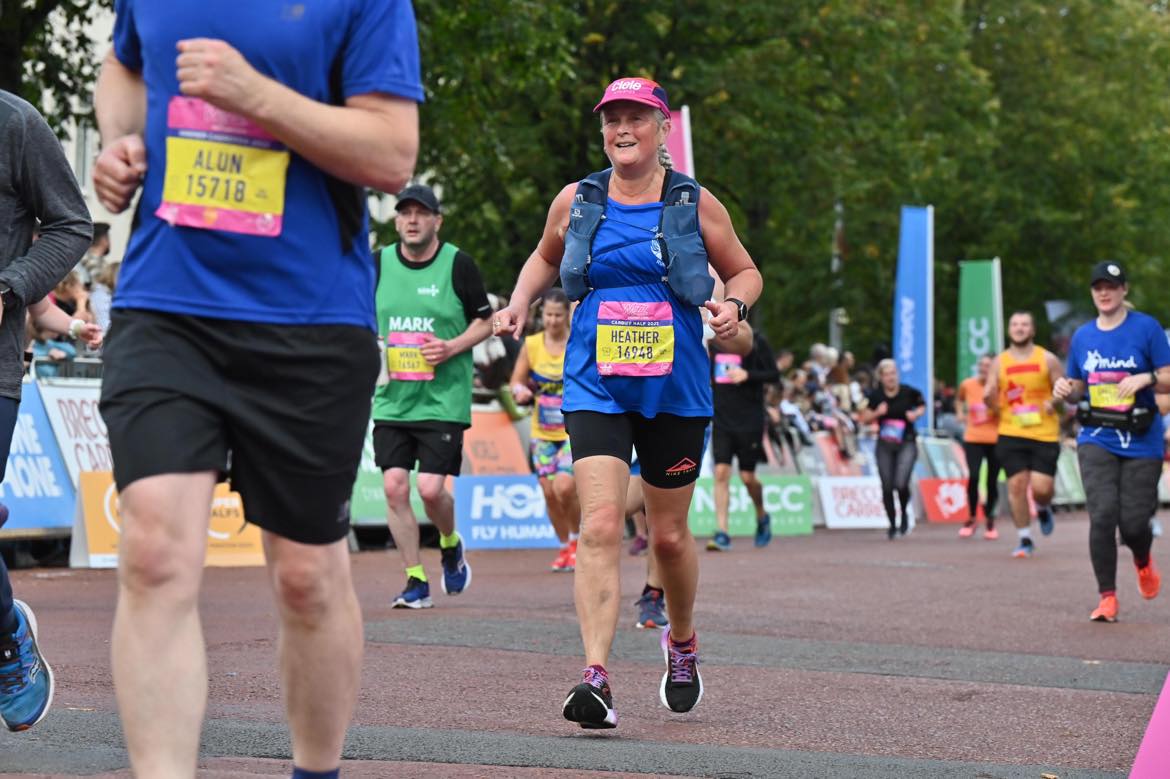 The author smiling as she approaches the finish of the Cardiff Half Marathon