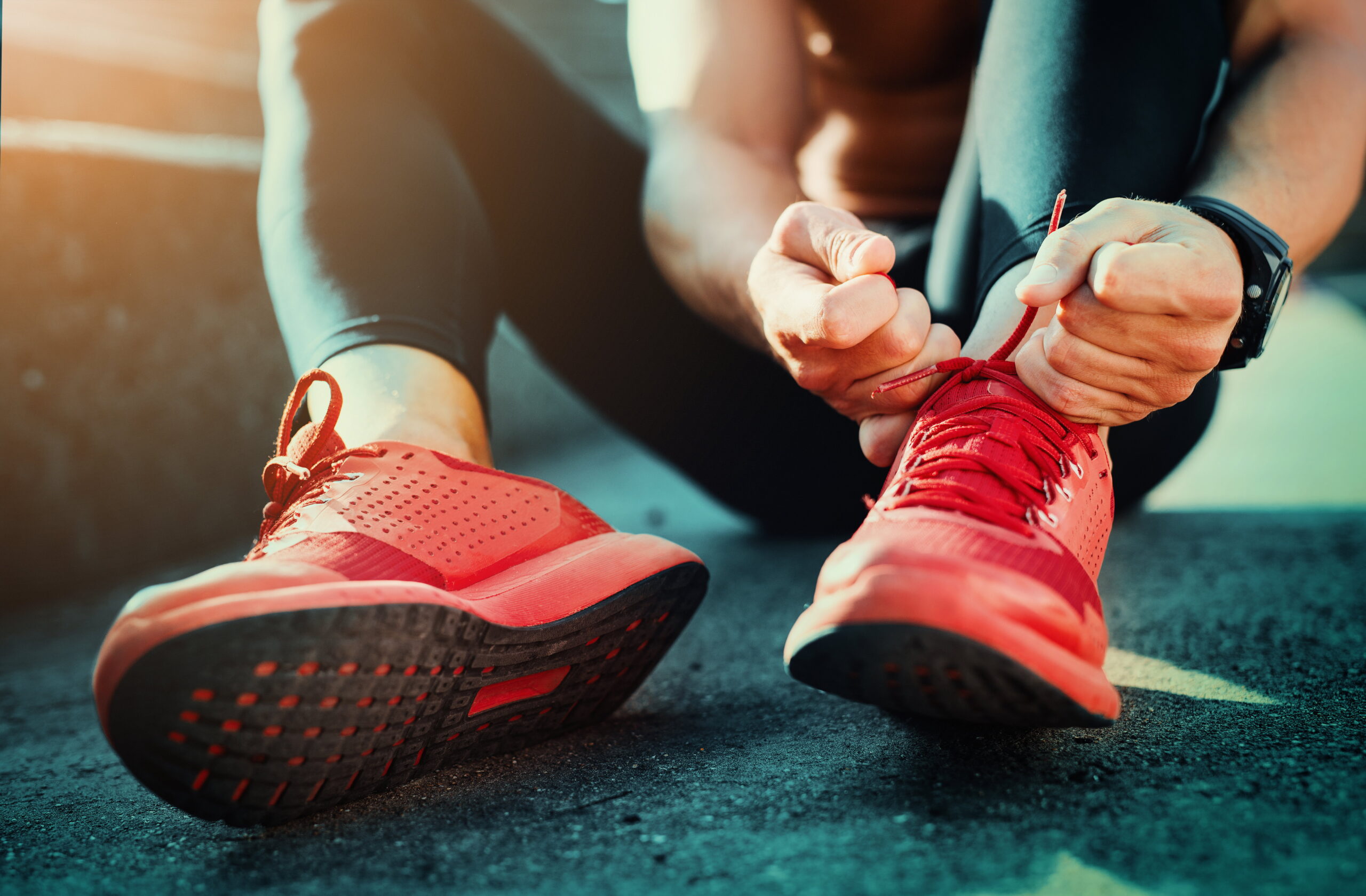 How Running Can Boost Your Mental Health Runner tying their trainer laces
